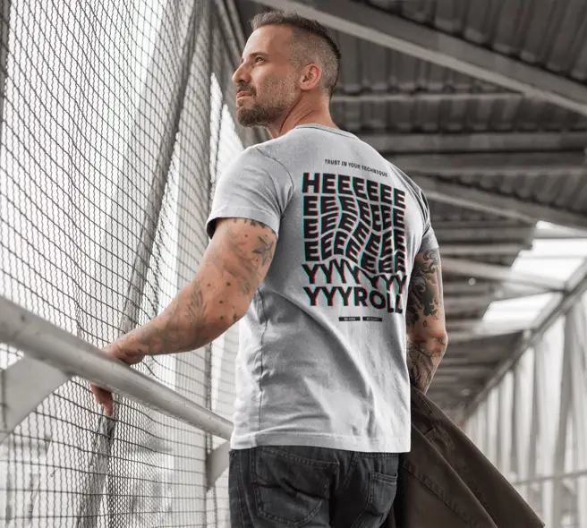 back-shot-of-a-man-wearing-a-sublimated-tee-mockup-walking-on-a-bridge-a9357b-AR07DZDpGNI4kZ0n